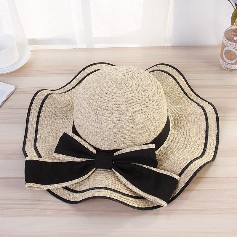 Women's Elegant Pastoral Simple Style Waves Bowknot Big Eaves Straw Hat display picture 2