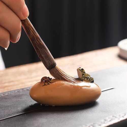 Manufacturer wholesale tea seat ornaments Yixing purple sand tea pet water spraying frog watermelon pumpkin lotus seed gourd tea set ornaments