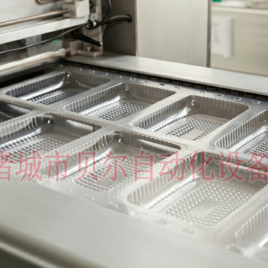 山东贝尔供应食品托盒贴体真空包装机，全自动连续贴体包装设备