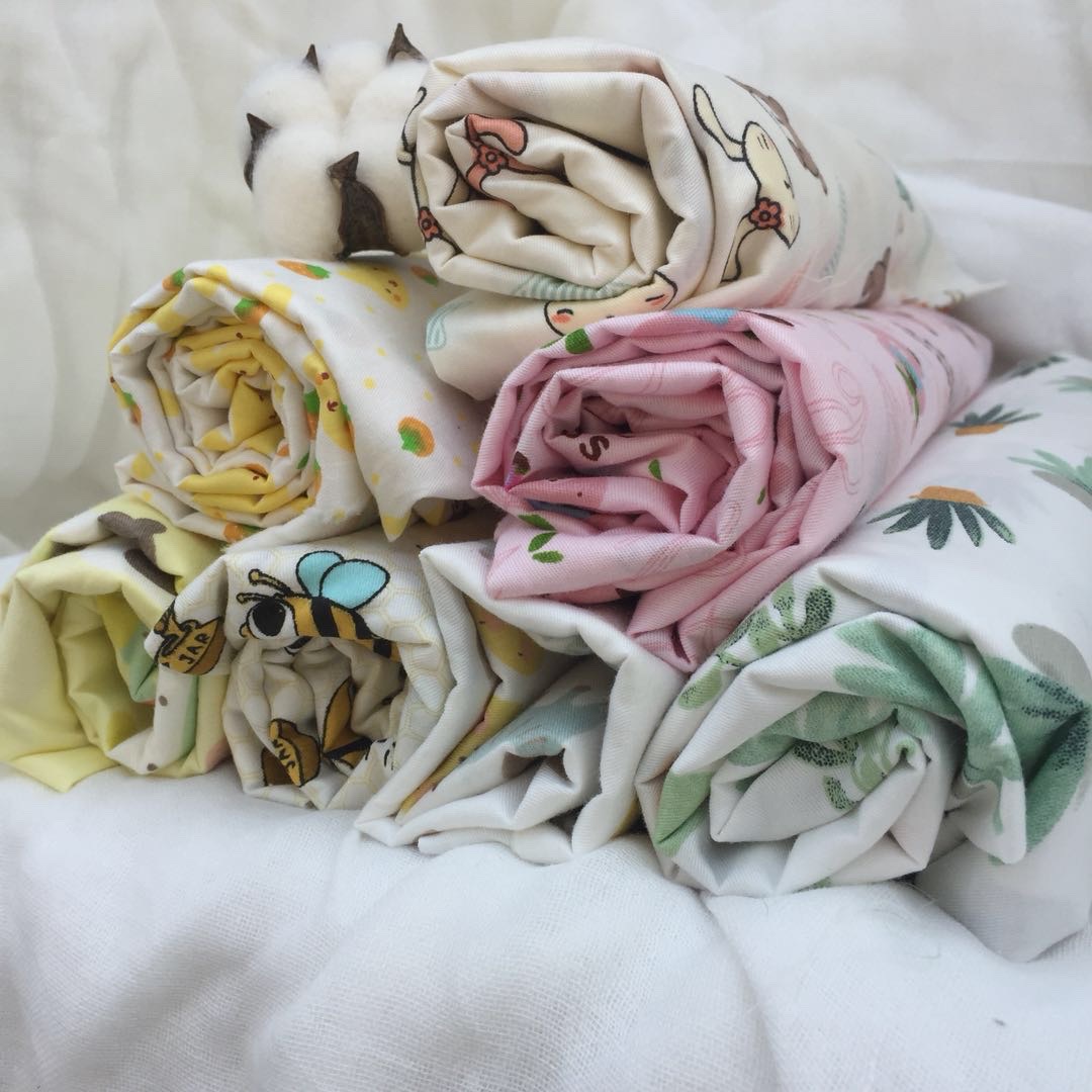 纯棉斜纹窄幅婴童床品面料 无荧光 卡通花行 现货供应