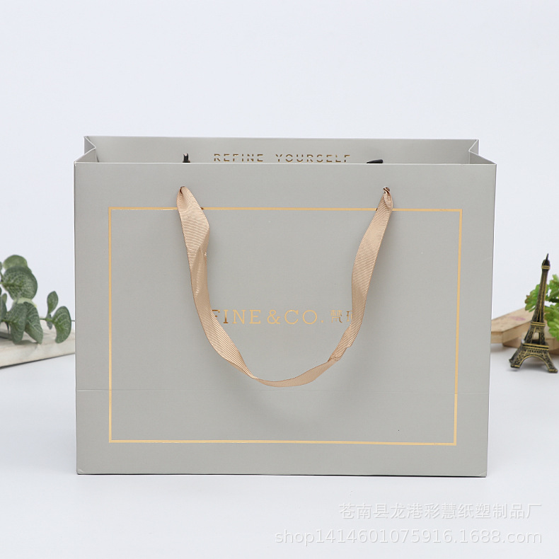 厂家定 做化妆品纸袋 高档烫金美容院广告手提袋 服装购物袋批发