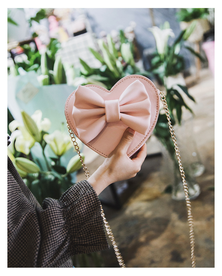 Unisex Small Pu Leather Solid Color Bow Knot Cute Heart-shaped Zipper Crossbody Bag display picture 18