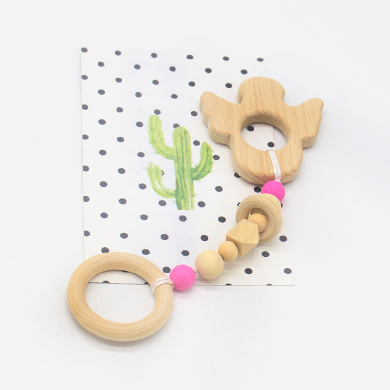 Suministros de bebé juguete de haya mordedor bebé Seguridad Protección del Medio Ambiente anillo de cuentas de silicona dientes molienda palo nuevo estilo