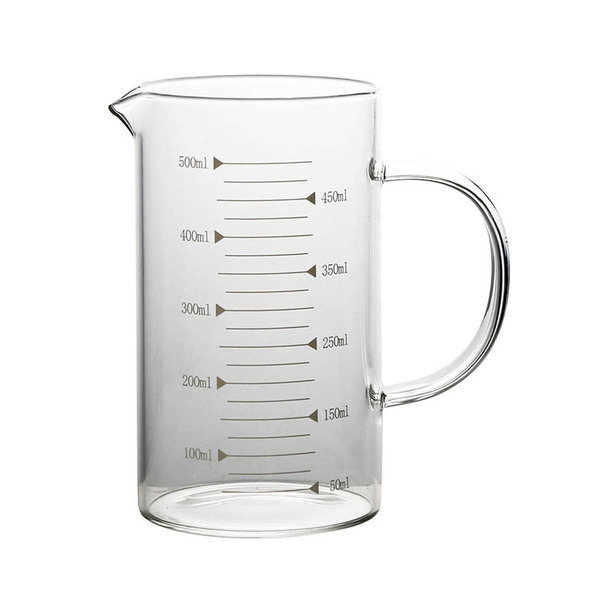Transparent glass measuring cup scaled