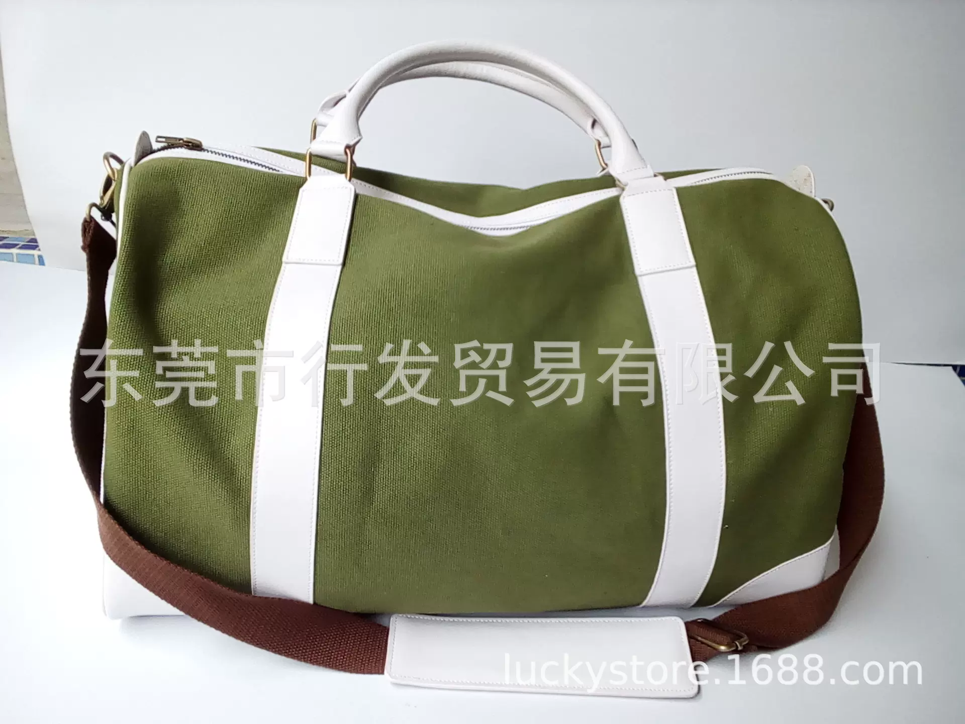 厂家定制新款绿色新美的手提旅行包可加单肩带可加印logo