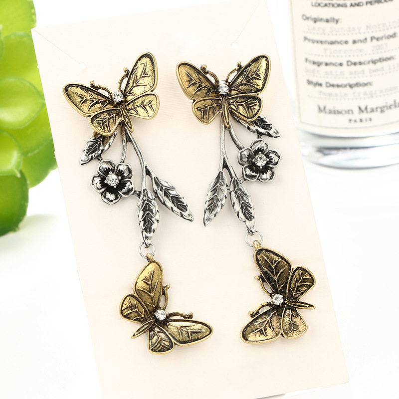 Européen Et Américain Nouveaux Accessoires Rétro De Mode Géométrie Motif Papillon Feuilles Fleur Alliage Longue Boucles D'oreilles Boucles D'oreilles display picture 4