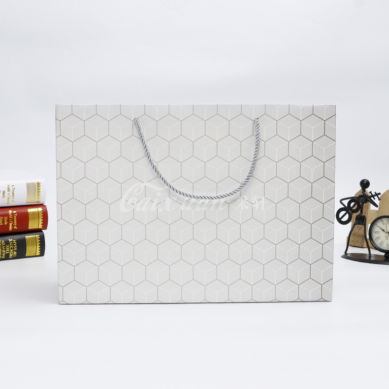 批发供应时尚简约白卡纸手提纸袋 通用商场服装购物礼品袋 定做