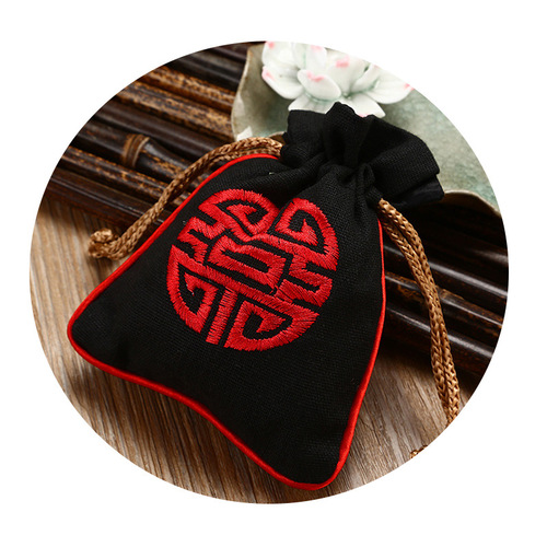 Drawstring-tied jute pouch for jewelry, accessories, gifts, and embroidered bracelet storage