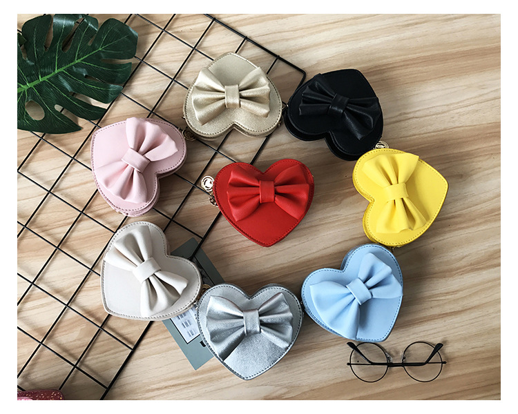 Unisex Small Pu Leather Solid Color Bow Knot Cute Heart-shaped Zipper Crossbody Bag display picture 44