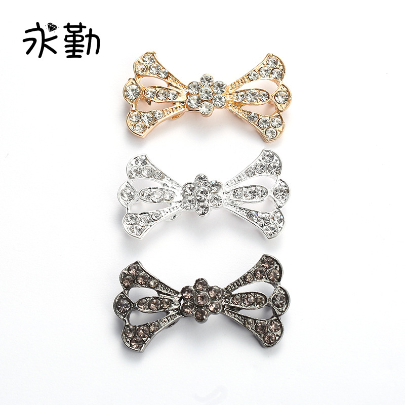 新款时尚电镀合金对扣 创意领结造型粘玻璃镶钻服装辅料搭扣批发