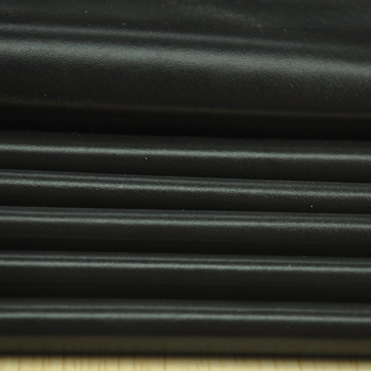 厂家直销黑色头层耳机纳帕牛皮皮料批发 耳机平纹高光牛皮皮革
