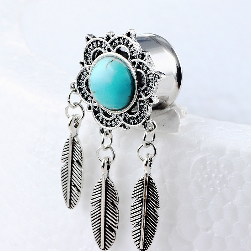 Silver pointed spike labret stud material detail