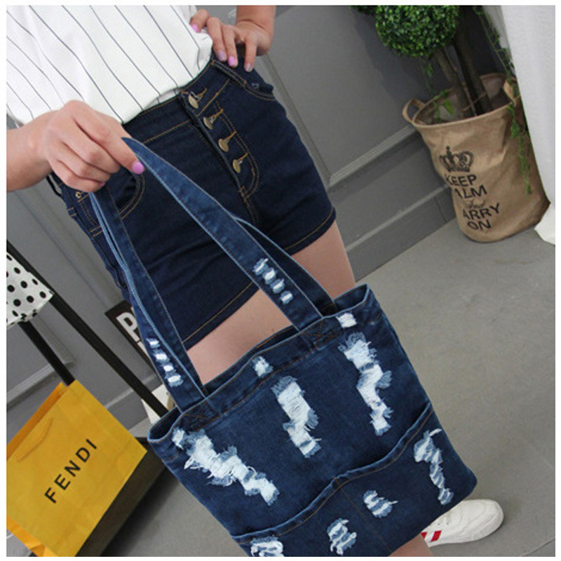 Bolsos de hombro vaquero nueva versión coreana de bolsos de moda con agujeros rotos bolsos de comercio exterior bolsos de gran capacidad bolsos de mujer en generación