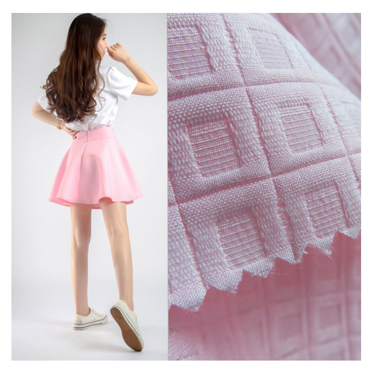 厂家现货 韩版时尚短裙女装服装用布 涤纶粉色格子提花布