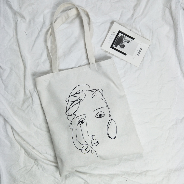 2021 Nuevo estilo fresco retrato abstracto bolsa de lona artístico fresco bolso de compras de las mujeres bolso de hombro del estudiante