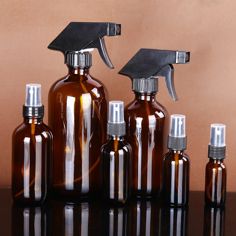 Cubierta integrada transparente líquido sub-botella de vidrio sellado Boston botella antideslizante cubierta de baquelita botella de aceite esencial al por mayor