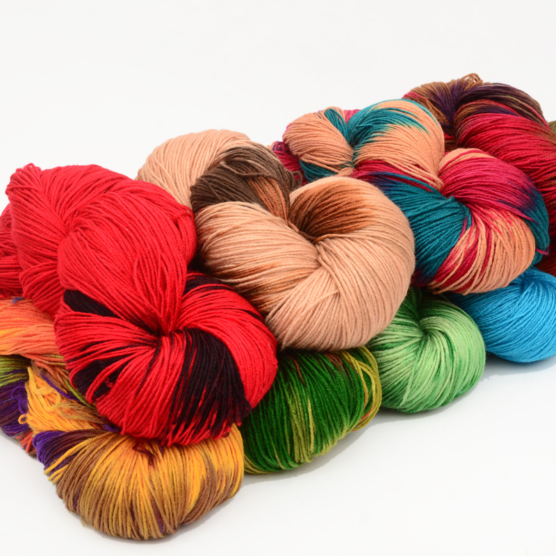 4 strands of colorful acrylic yarn, colo...