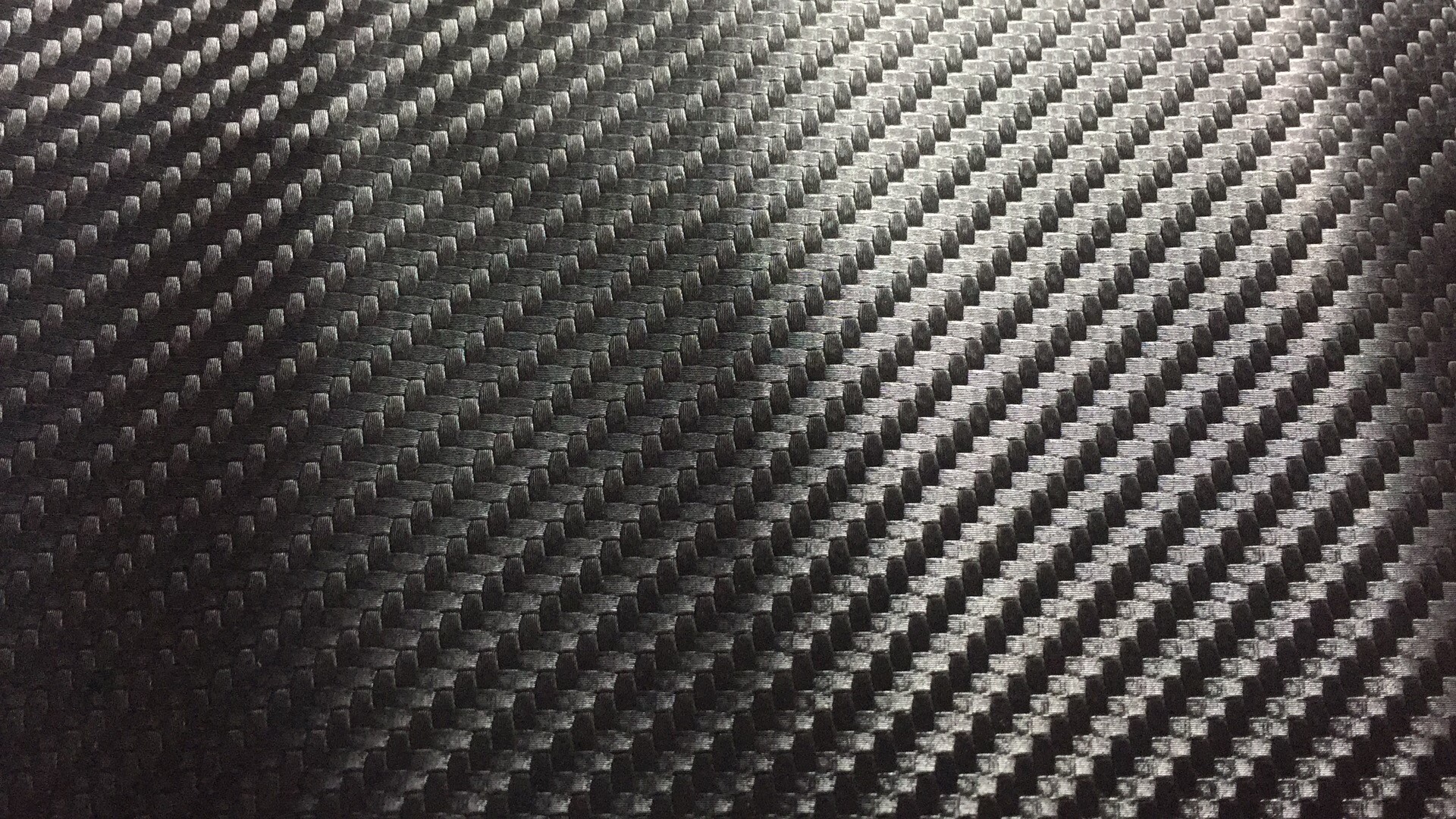 草席纹炭纤维0.5m无纺布水刺底PU皮革人造革电子包装酒盒汽车垫