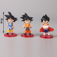 13 Dragon Ball figure models of Goku, Goten, Piccolo, Chi-Chi, Bulma, Vegeta, and a cake display