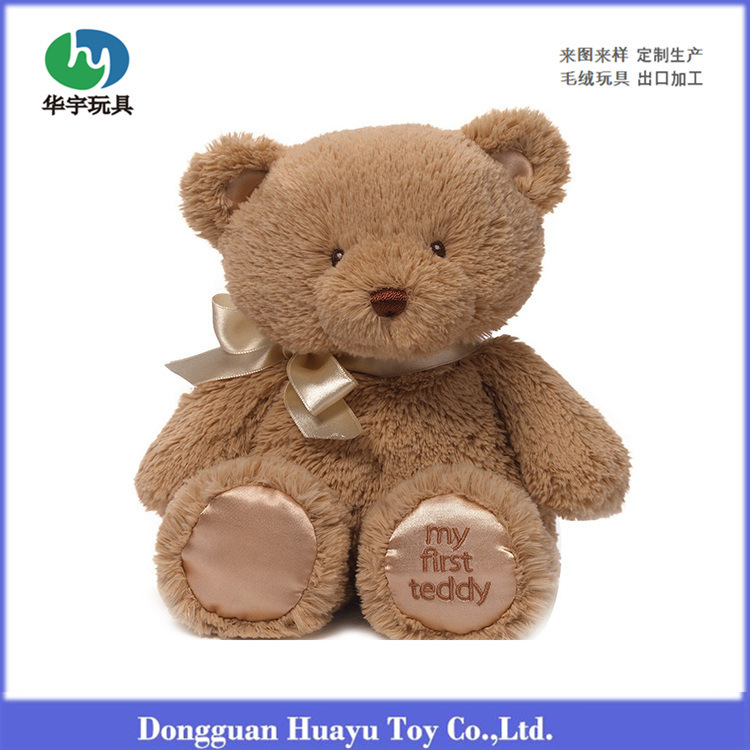 The plush toy teddy bear doll with ribbo...