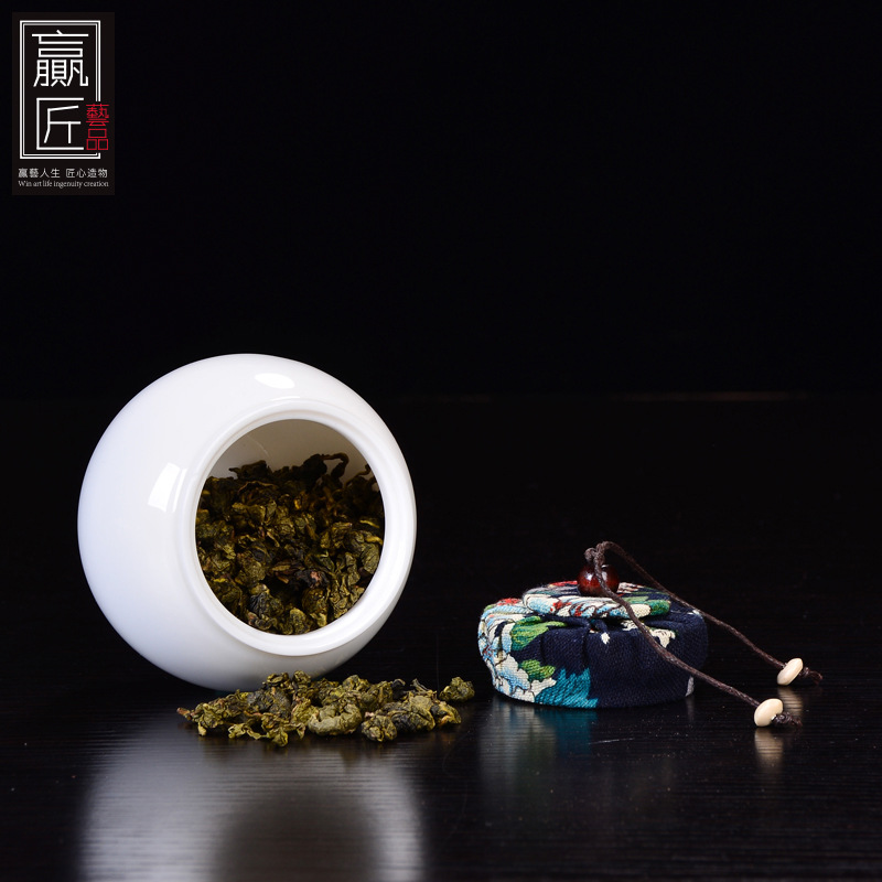 Winjiang blanco porcelana sellada tarro de té Corcho de cerámica sellado tarro pequeño tamaño Pu'er almacén de té ovejas grasa Jade porcelana tarro de té