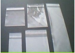 Narrow, elongated 7 x 31 cm transparent OPP bags with self-adhesive labels—jewelry bags, 100 pieces per pack, double-layered, 5-micron thickness