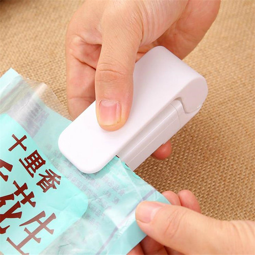 Mini small sealing machine food preservation plastic bag sealer hand pressure heat sealing machine bag sealing clip