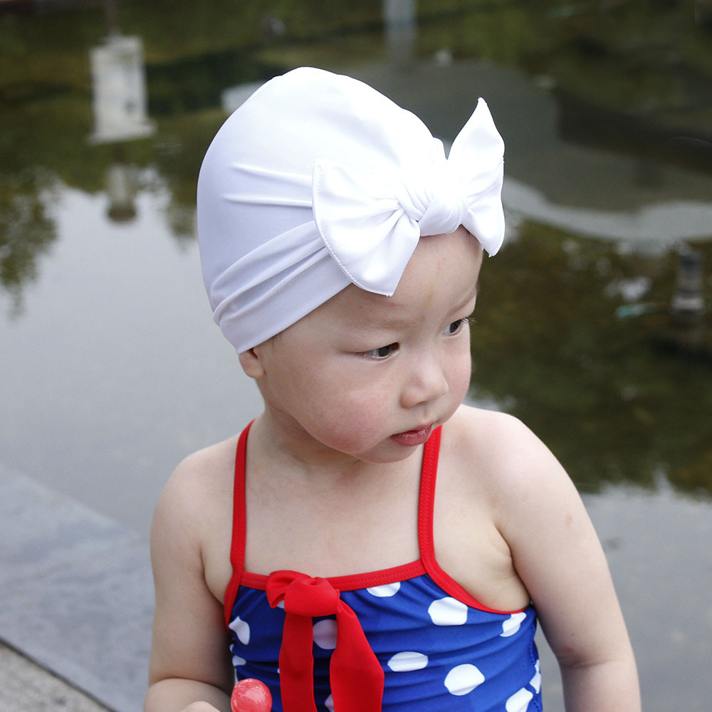 Children&#39;s Swimming Cap Bowknot Hat Good Elasticity Solid Color Printing Baby Swimming Cap display picture 16