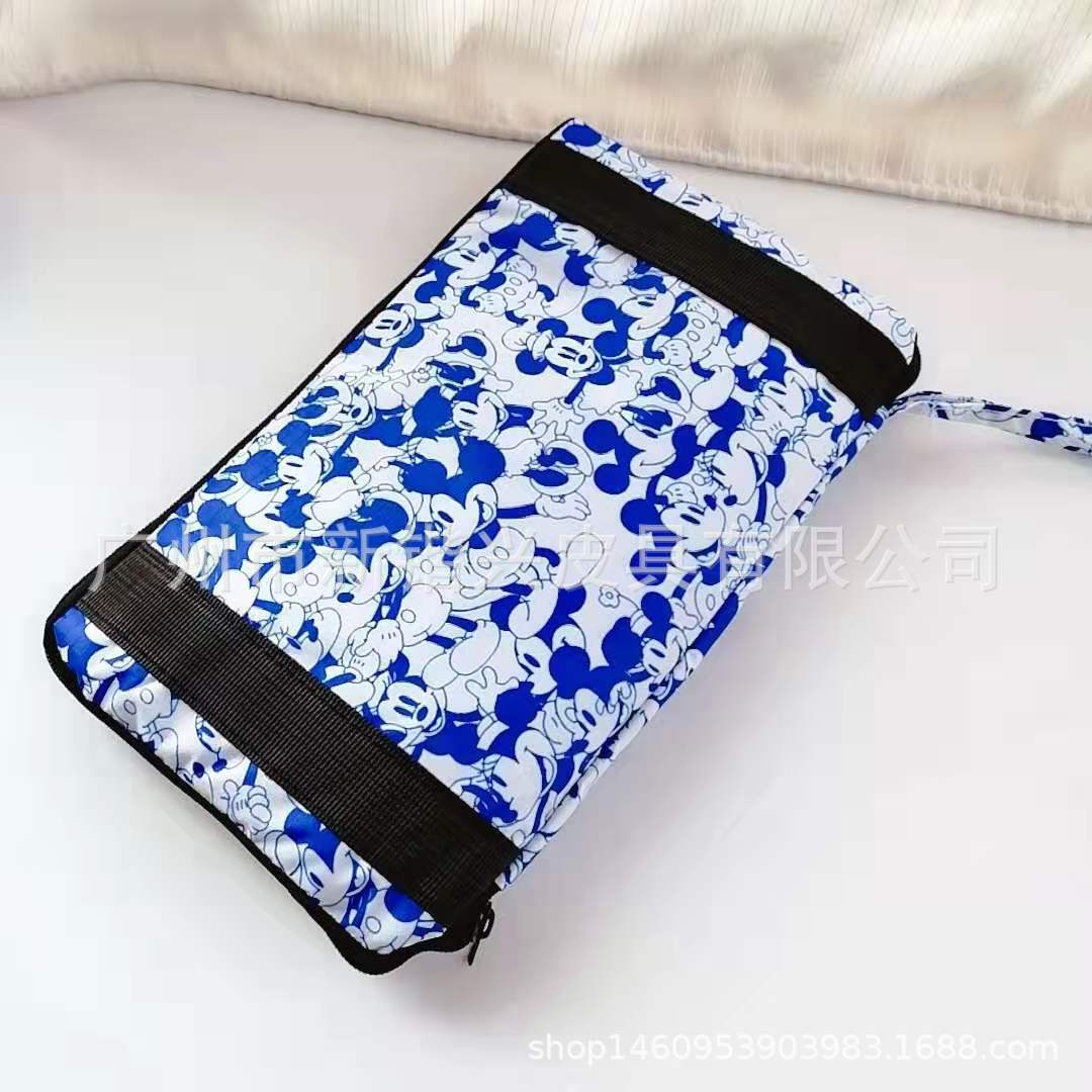 布丁犬玉桂犬美楽蒂k.t防水アニメ携帯折りたたみ旅行バッグはスーツケースに固定できます。