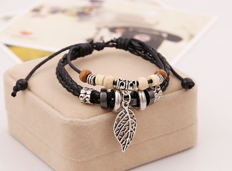 Korean version of imitation cowhide bracelet simple wild alloy leaf pendant woven leather bracelet