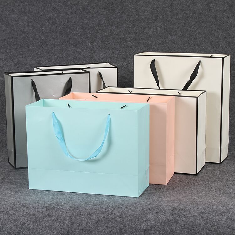 定制LOGO新品女装鞋店蜂蜜礼品袋包装袋化妆品面膜手提纸袋广告袋