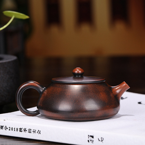 Yixing purple clay teapots are handmade and customized by famous manufacturers. Wholesale and delivery services. High-quality Nixing pottery carved and painted stone ladle teapots.