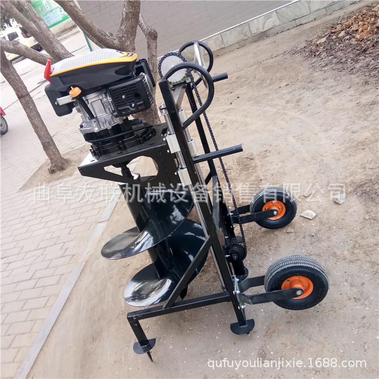 新型螺旋式地面打孔机 热销大棚立柱埋桩机 地面挖坑机的型号 60