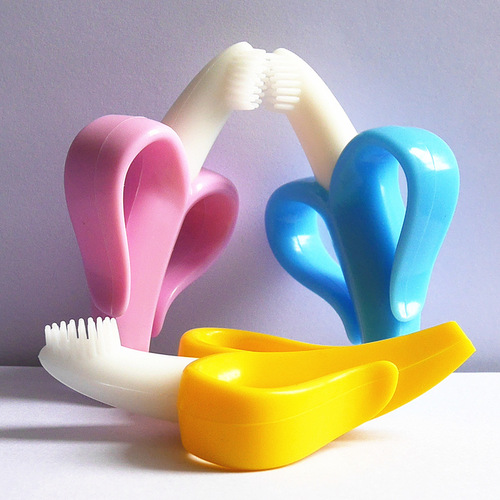 Factory direct selling banana toothbrush, baby teether, baby silicone molar stick, banana shaped baby toothbrush in bulk