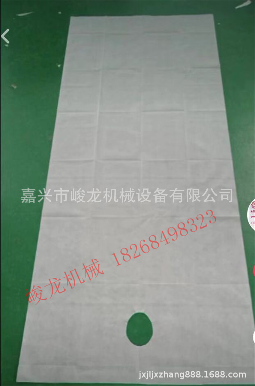 全自动无纺布床单打卷设备，美容床单折叠设备，一次性床单机器