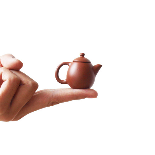 Mini purple clay pot handmade creative small pocket fingertip pot small tea play tea pet ornaments Kung Fu tea set can be raised