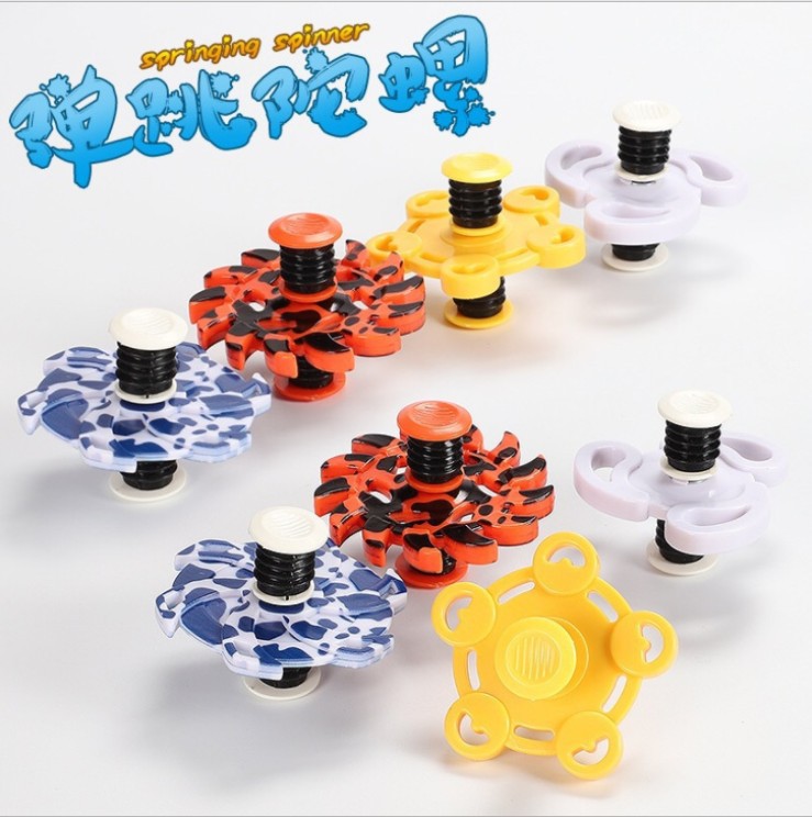 新款地攤熱賣彈跳陀螺創意高速旋轉陀螺三腳彈簧正反倒立陀螺