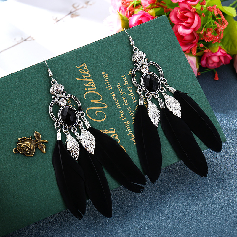 Retro Alloy Hollow Geometric Tassel Feather Exotic Leaves Earrings Wholesale display picture 3