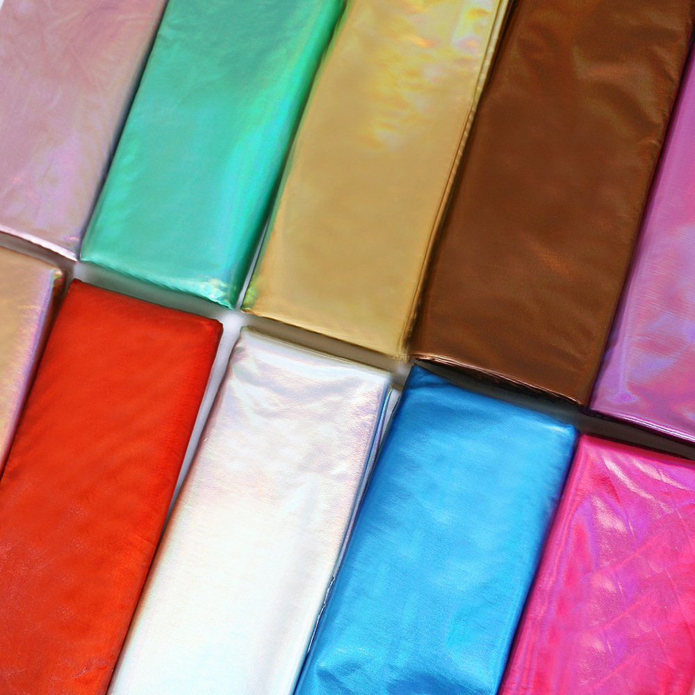 厂家供应 氨纶素面镭满版 烫金布四面弹力 舞台服装箱包针织面料