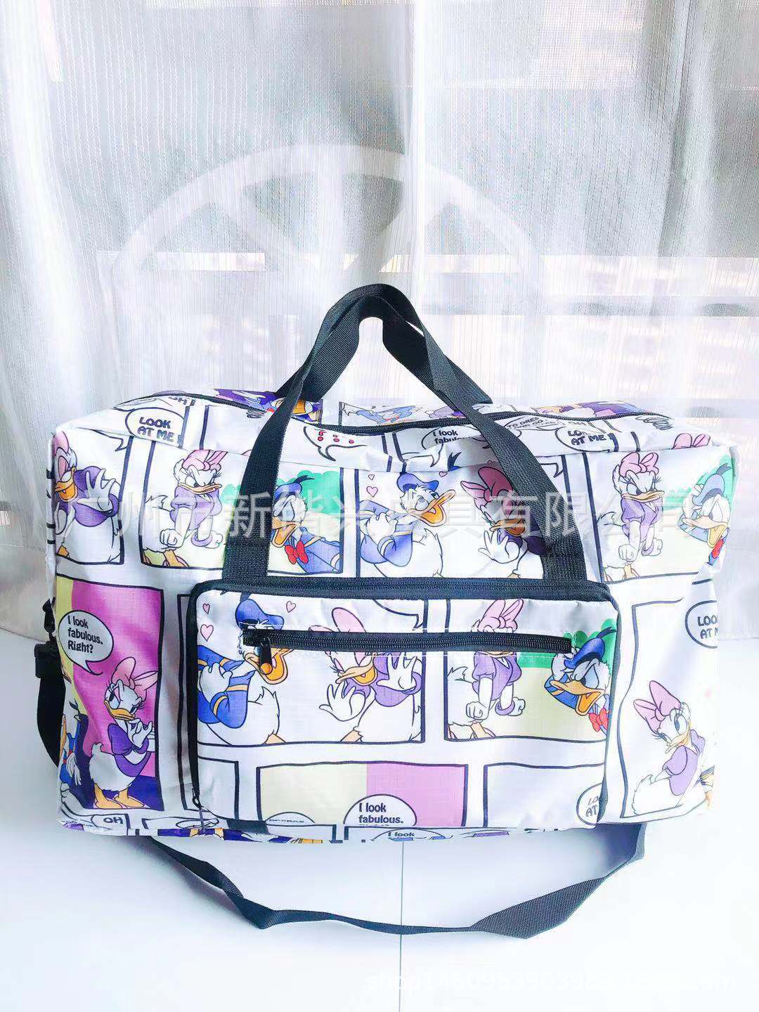 布丁犬玉桂犬美楽蒂k.t防水アニメ携帯折りたたみ旅行バッグはスーツケースに固定できます。