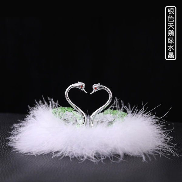 Silver swan + green crystal + feathers