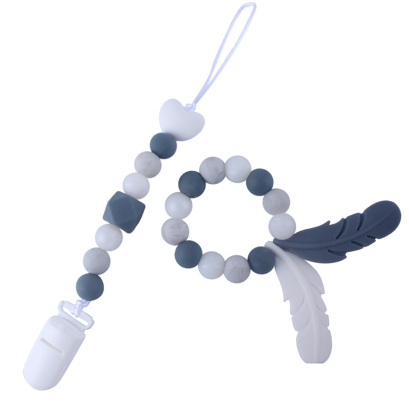 Productos para bebés de silicona chupete cadena mordedor pluma de dibujos animados de silicona juguete dientes molienda teether traje