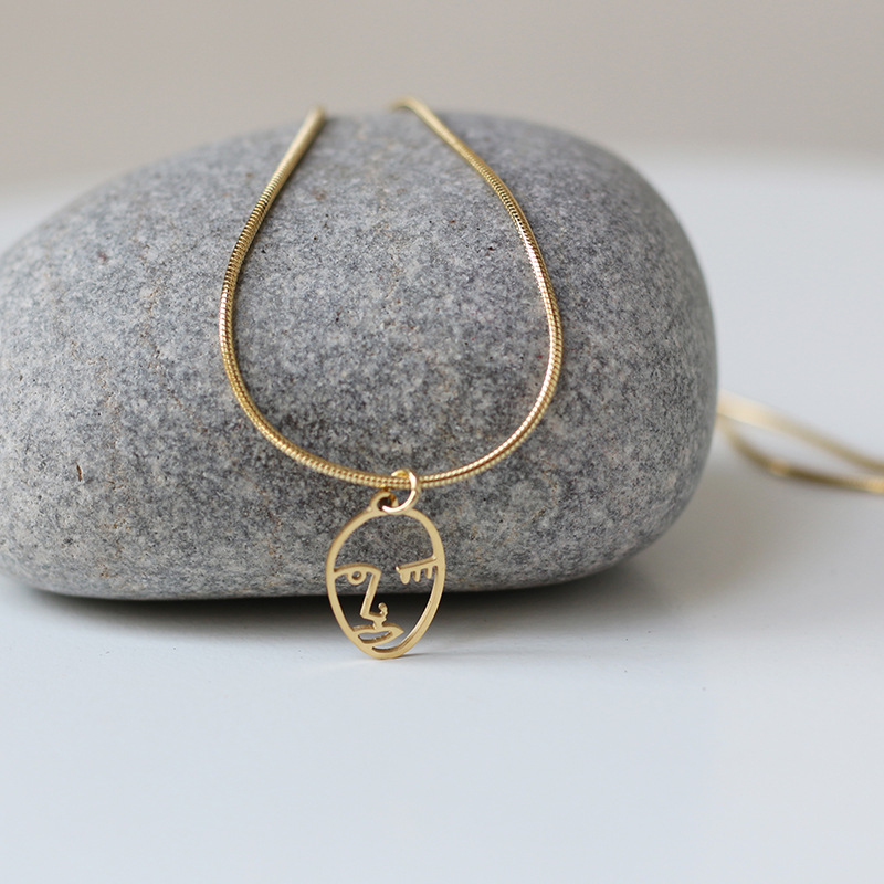 Small crowd of faces with irregular lines snake bone chain necklace titanium steel 18K gold platedpicture3