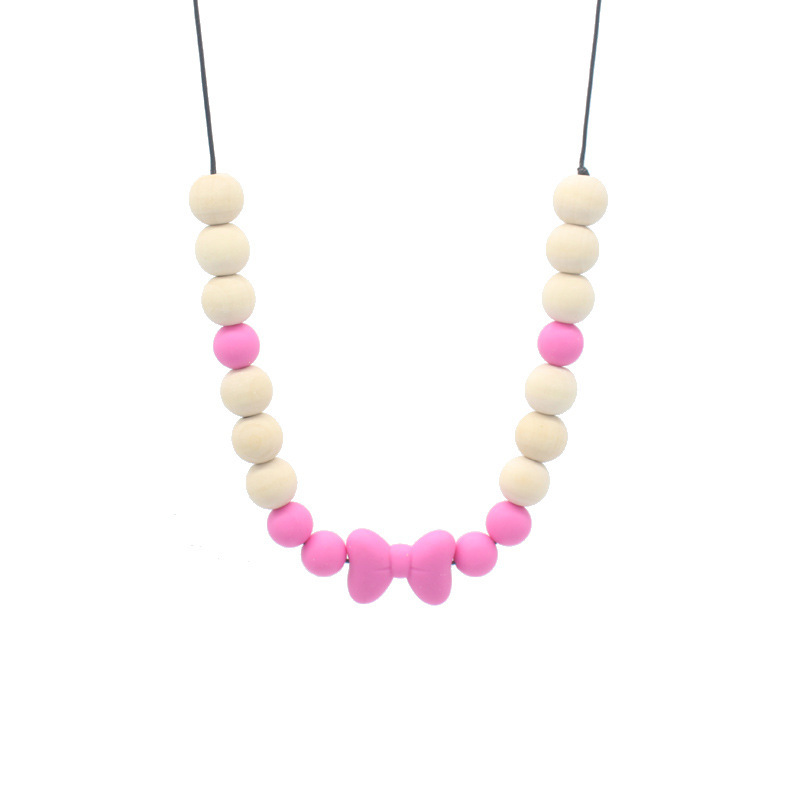Bebé arco mordedor collar bebé joyería de los niños mordedor palo de silicona collar de cuentas de madera mordida colgante de pegamento