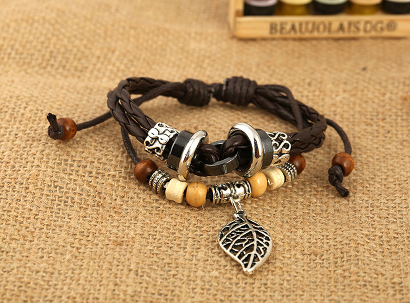 Korean version of imitation cowhide bracelet simple wild alloy leaf pendant woven leather bracelet