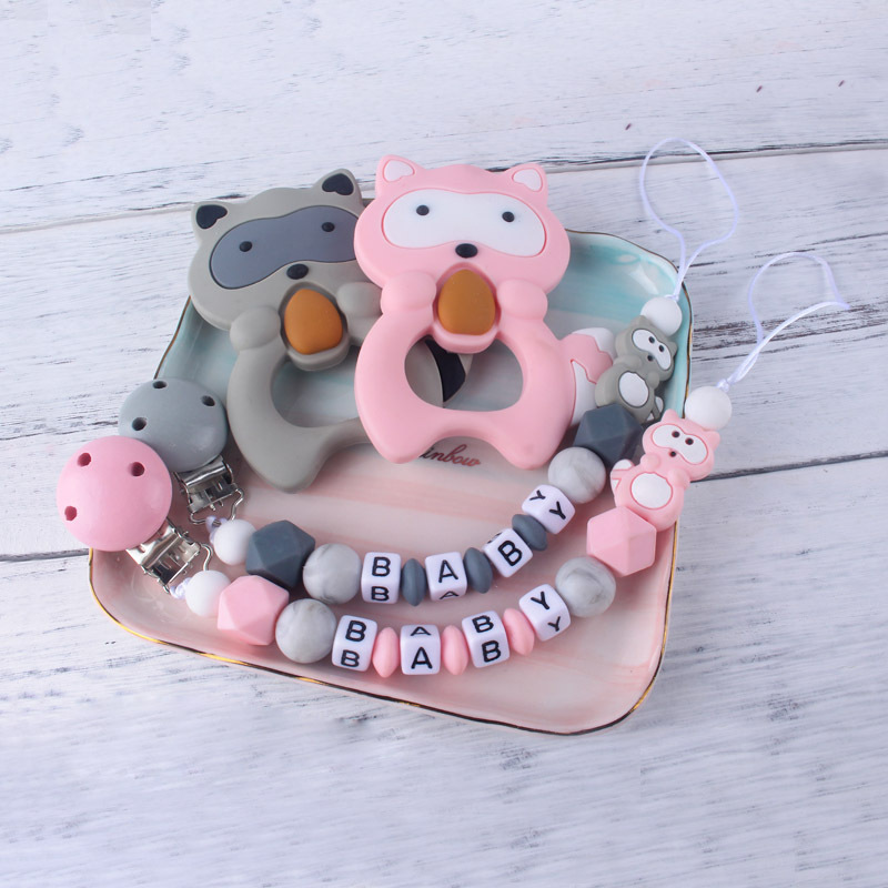 Teether chupete cadena bebé chupete de silicona clip Amazon Comercio exterior teether traje nuevo mapache la historieta