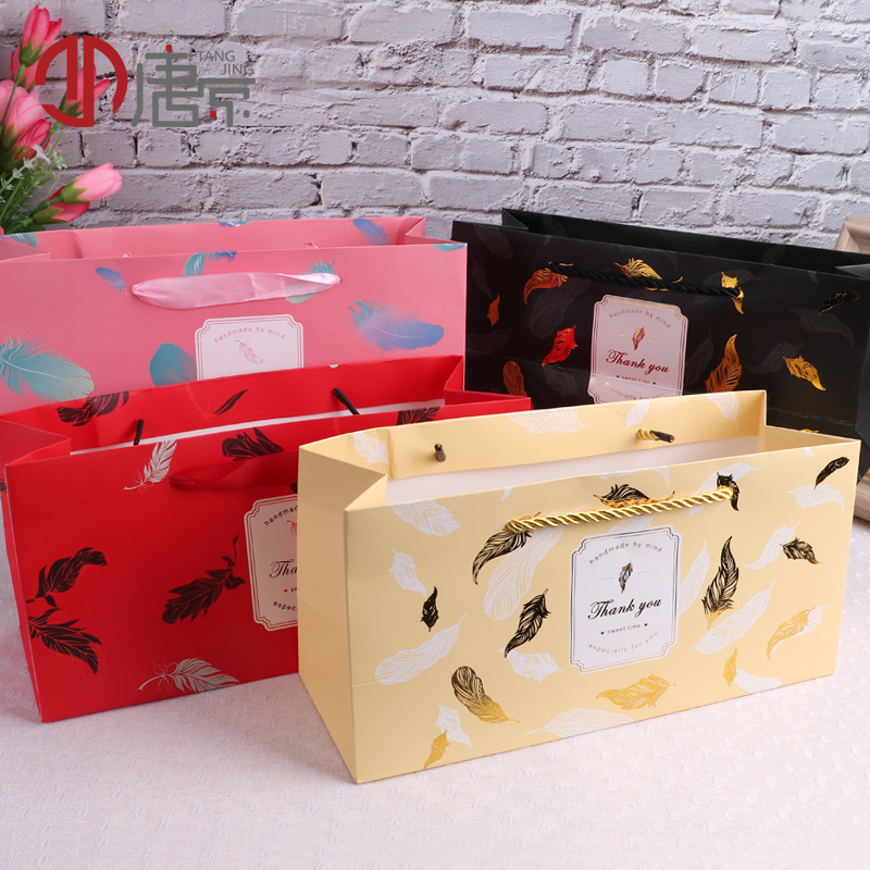 羽毛 手提袋纸袋  烫金红色树藤 thank you 黑色树叶 手提袋