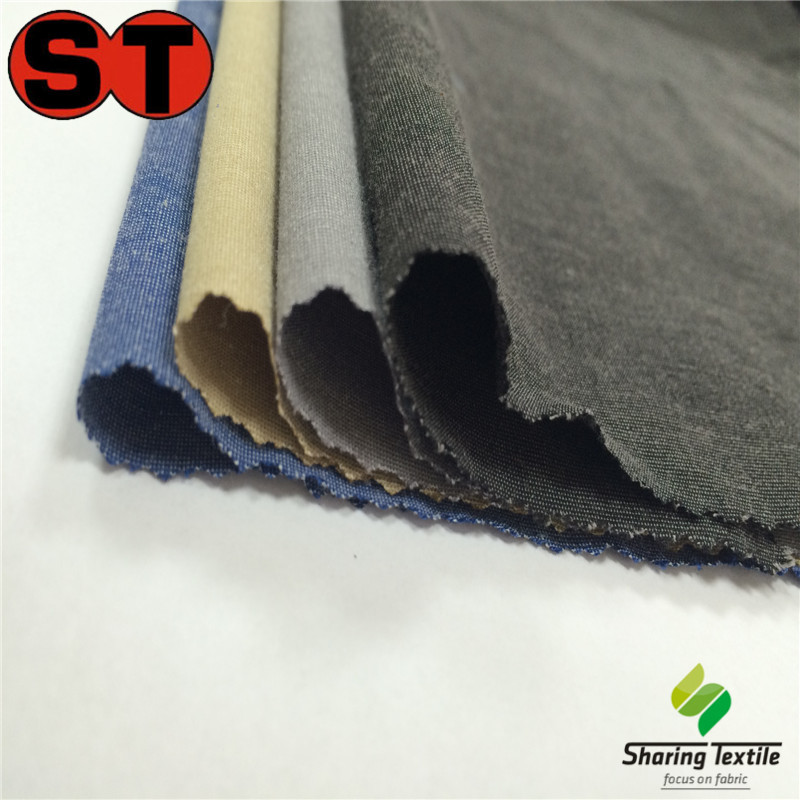 现货库存免费供样50D+40D*32S+40D涤棉提花弹力夹克&沙滩裤面料