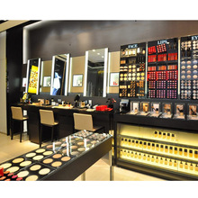 大型商场彩妆店粉底中岛不锈钢展示台化妆品木质靠墙展示柜带灯