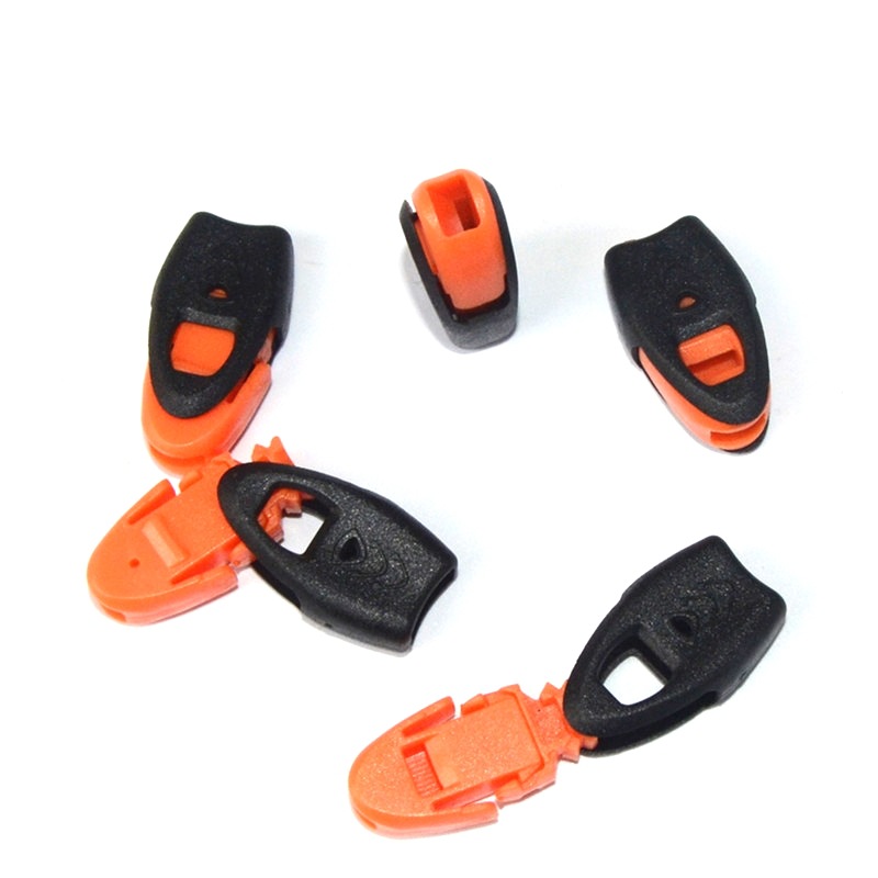 Silbato de supervivencia tire clip de cola clip de cuerda silbato independiente de alta puntuación Shell de plástico tire cola hebilla silbato cola clip de cuerda hebilla